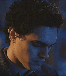 a close up of a man 's face with his eyes closed