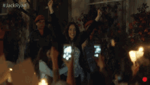a group of people holding up their fists in the air with #jackryan written above them