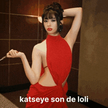 a woman in a red dress is holding a coffee mug with the word gabia on it