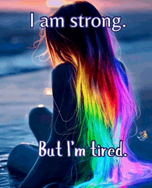 a girl with rainbow hair says i am strong but i am tired