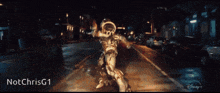 a statue of a man walking down a street with the name notchrisg1 at the top