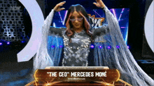a woman named mercedes mone is on a stage