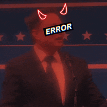 a man in a suit and tie stands in front of a microphone with a sticker on his face that says error