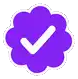 a purple flower with a white check mark inside of it