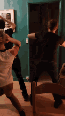 a group of people dancing in a dark room