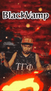 a man singing into a microphone in front of a red background that says black vamp