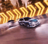 two cars are racing on a track and one has a bmw logo on the front