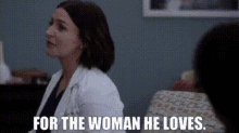 a woman in a lab coat is sitting next to a man in a chair and says `` for the woman he loves '' .