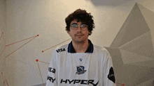 a man wearing a white shirt that says hyper