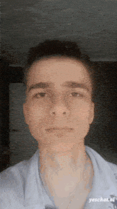 a young man taking a selfie with the words yeschat at the bottom of the image