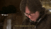 a man wearing glasses is laughing and says he can 't keep getting away with this