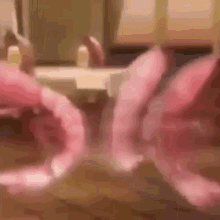 a close up of a person 's mouth with a pink ribbon around it .