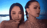 two women are standing next to each other and one is making a funny face