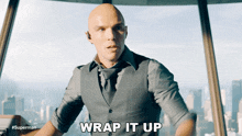 a man in a suit says wrap it up