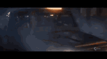 a car is on fire in the dark and the lights are shining