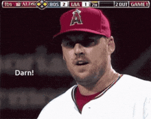 a baseball player wearing a red hat with the letter a on it says darn