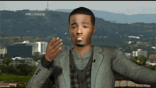 a man in a suit stands in front of a mountain