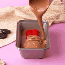 a loaf pan filled with chocolate ice cream and a red heart