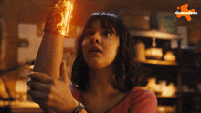 a nickelodeon ad shows a woman holding a bracelet