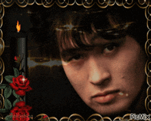 a picture of a man with a candle in the background and the words picmix on the bottom right
