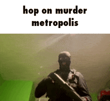 a man in a mask is holding a gun in a room with the words `` hop on murder metropolis '' written above him .
