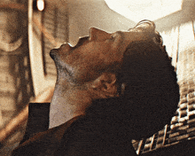 a close up of a man 's neck and face