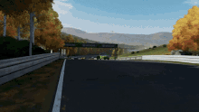 a green car is driving down a road with a green sign that says xbox