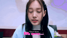 a girl with her eyes closed is wearing a headband that says ' your bias ' on it