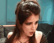 a close up of a woman 's face with long hair