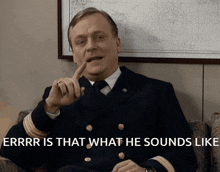 a man in a navy uniform is sitting in a chair with the words " errr is that what he sounds like " behind him