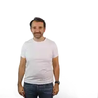 a man wearing a white t-shirt and blue jeans stands in front of a white background