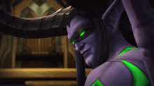 a purple demon with green eyes and horns is smiling