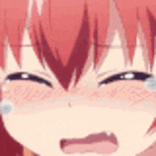 a close up of a girl with red hair crying with tears running down her face .