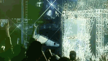 a crowd of people at a concert with a sign behind them that says ranger