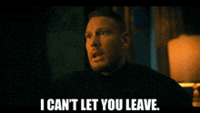 a man is sitting in a room with a lamp and says `` i can 't let you leave . ''