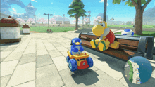 a penguin and a turtle sit on a bench in a park