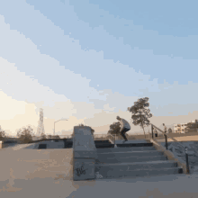 a skateboarder is doing a trick on a set of stairs with the word big on the wall
