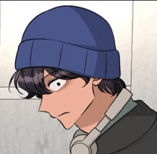 a man wearing headphones and a blue hat