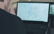 a man looking at a drawing of a woman on a laptop