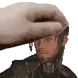 a pixelated image of a man 's head being touched by a hand