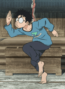 a man in a blue shirt with the number 7 on it is jumping in the air