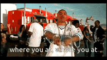 a man is standing in front of a group of people with the words where you at