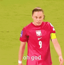 a female soccer player wearing a number 9 jersey is standing on a field .