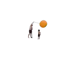 a man and a boy are playing with a balloon that looks like an orange pineapple