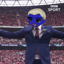 a man in a suit and tie stands in front of a crowd at a bbc sport stadium