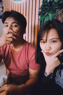 a man and a woman are posing for a picture on a date of 2015/05/19