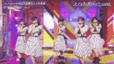 a group of girls in striped dresses are singing let 's sing on stage