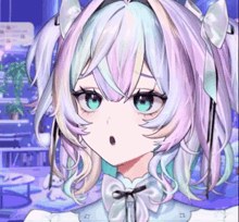 a close up of a girl 's face with a surprised look on her face .