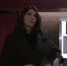 a woman says " not on my bloody watch " in a dark room