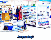 a woman is laying on the floor in a store with the words are you okay